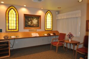 Room with stained glass windows and desk