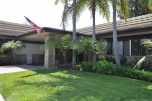 Entrance to building with grass lawn out front