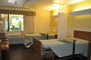 Room with two empty hospital beds