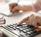 Woman using calculator