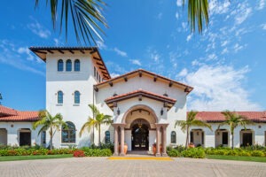 Exterior entrance to white Spanish colonial style building