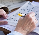 Women doing crossword memory puzzle