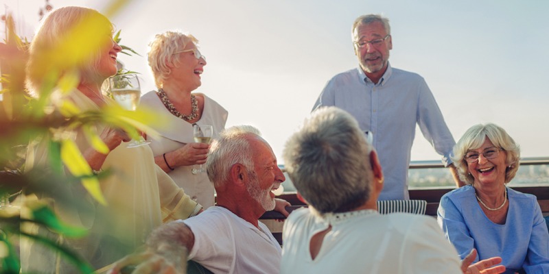 Group of men and women laughing together